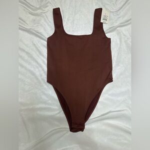 A new day body suit size small
